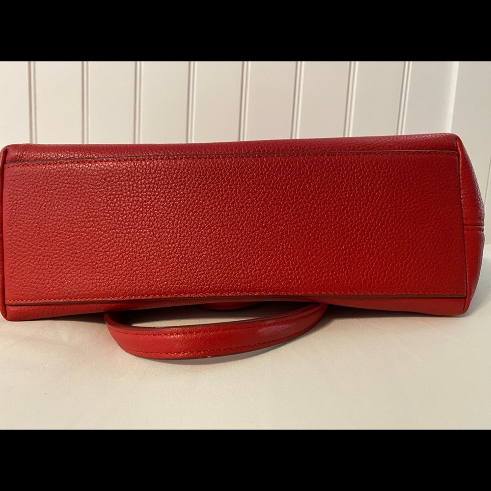 Red with silver hardware Coach purse. 14” x 8  Very good condition.